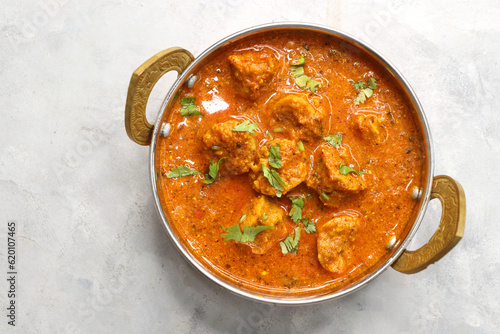 Rajasthani Gatta Curry or Besan Ke Gatte Ki Sabzi. Gatte are gram flour roundels or chickpea flour dumplings are cooked in a spicy, tangy yogurt based curry. delicacy of Rajasthan, India. copy space. photo