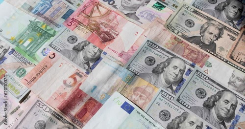 Money dollars hryvnia euros rotate rubles of various denominations 
rotate