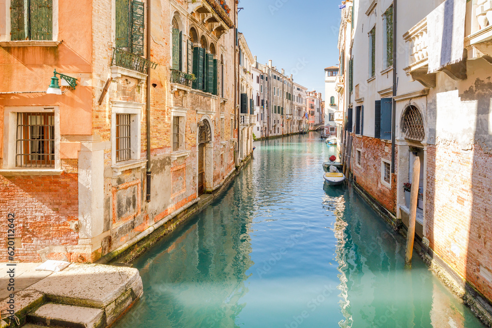 Canal with historic buildings in Venice, Italy, Europe.
