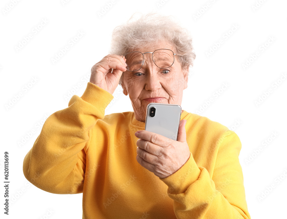 Senior woman in eyeglasses with mobile phone on white background Senior woman in eyeglasses with mobile phone on white background