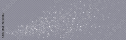 Particles of white magic dust. Shining light particles.Christmas glitter particles. Light effect on a transparent background