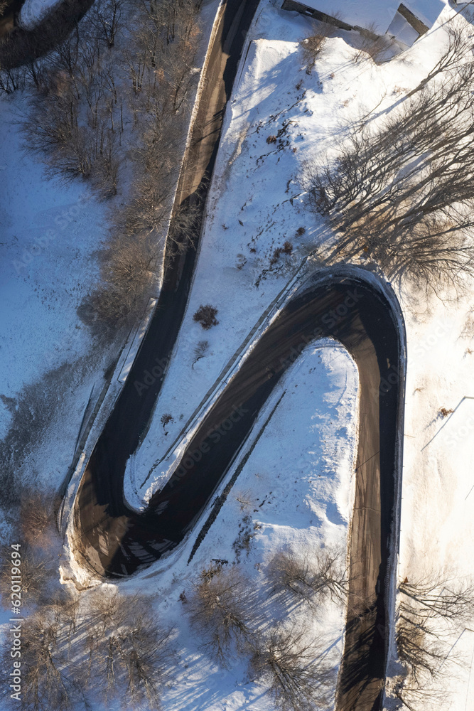 Aerial view of a snowy road