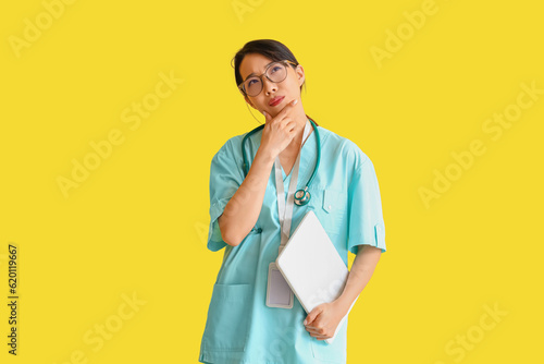 Thoughtful asian female doc...