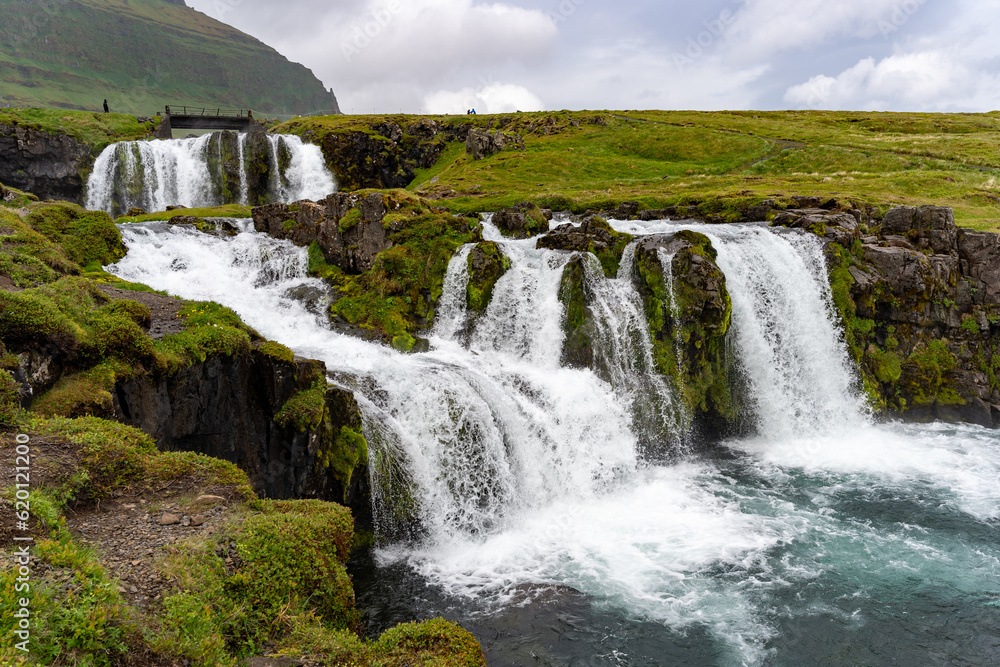 Kirkjufellsfoss waterfall in Iceland in summer Kirkjufellsfoss waterfall in Iceland in summer