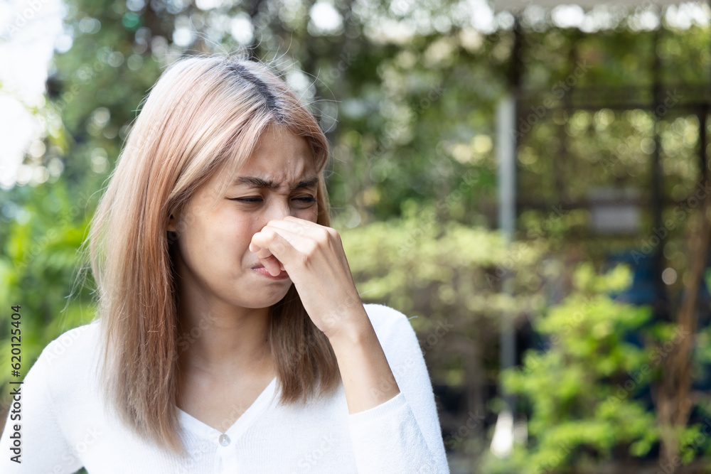 Stinking Odor and Disgusted Expression, Woman Reacting to Unpleasant Smell, Concept Image Stinking Odor and Disgusted Expression, Woman Reacting to Unpleasant Smell, Concept Image