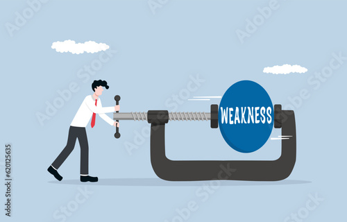Reducing self-weakness, endeavor for personal growth and development concept, Businessman using clamping to squeeze and reduce size of weakness ball.