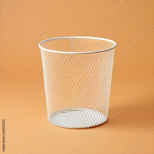 empty wire trash can isolated on plain yellow studio background, made with generative ai