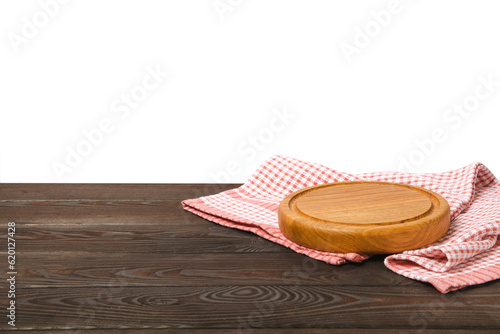 Cutting board on brown table and isolated background. Kitchen wooden cutting board and kitchen towel. Kitchenware. Menu. Recipe. The concept of cooking. Mockup