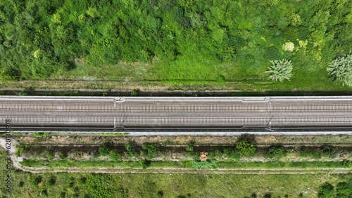 Zenith view: aerial image of a section of the empty high-speed HS railroad between Pama and Reggio Emilia, Italy