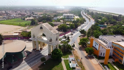 Cinematic drone view flying towards 22 nd July Arch at Banjul entrance, The Gambia - West Africa photo