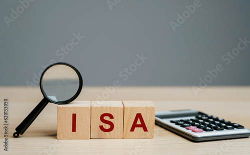 ISA - Individual Savings Account on a wooden blocks. Class of retail investment arrangement available to residents of the United Kingdom. Business and finance concept photo