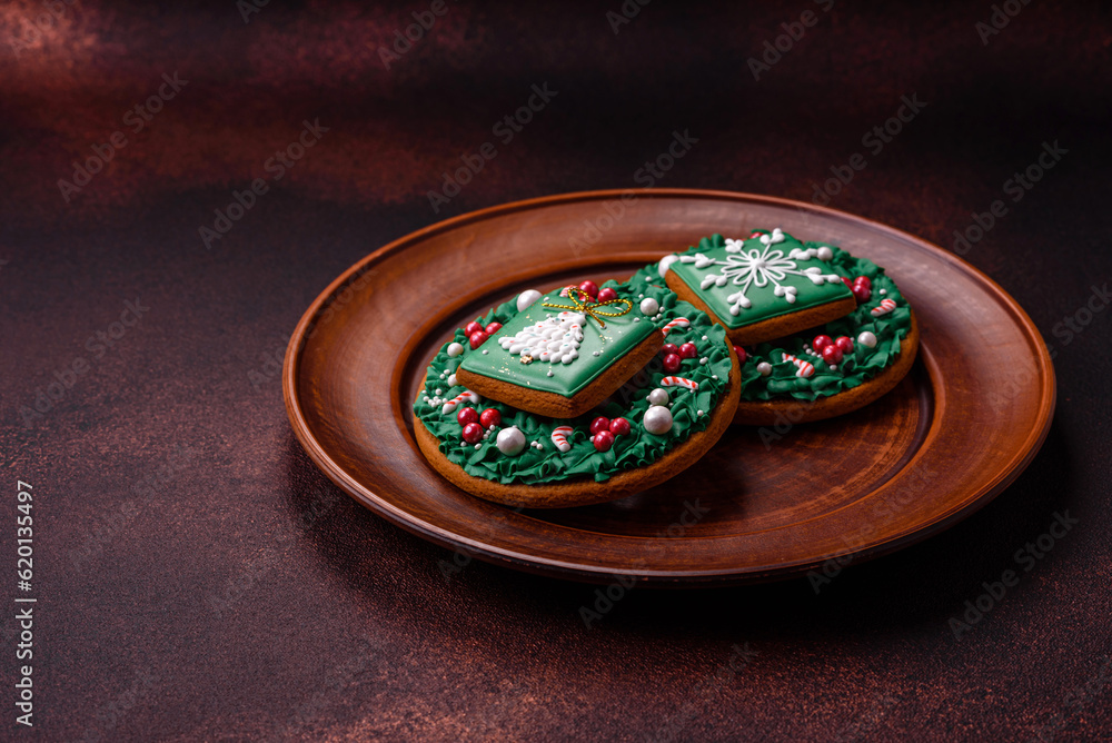 Beautiful delicious Christmas gingerbread on a concrete texture background Beautiful delicious Christmas gingerbread on a concrete texture background