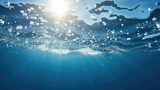 Underwater looking up on the surface blue sky background sunbeam - Generative AI