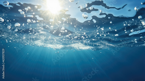 Underwater looking up on the surface blue sky background sunbeam - Generative AI © RobertNyholm