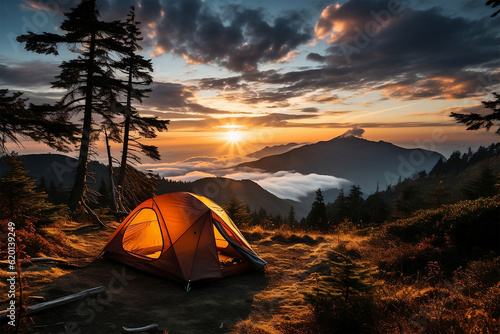 A breathtaking scene of a camping tent perched high in the mountains, surrounded by the golden glow of a vibrant sunset.