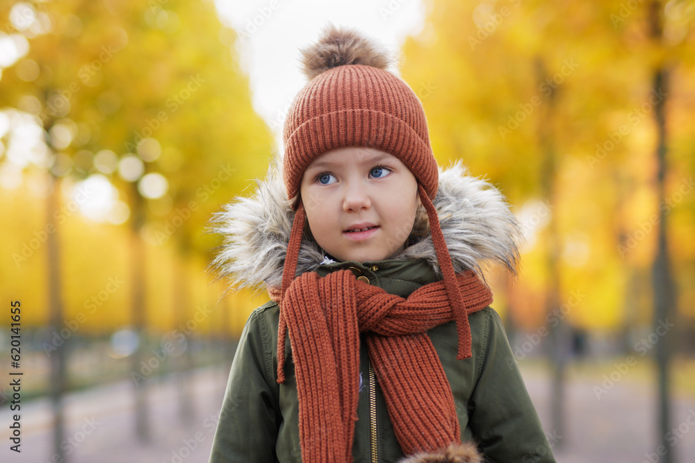 portrait of little girl walking in autumn city park portrait of little girl walking in autumn city park