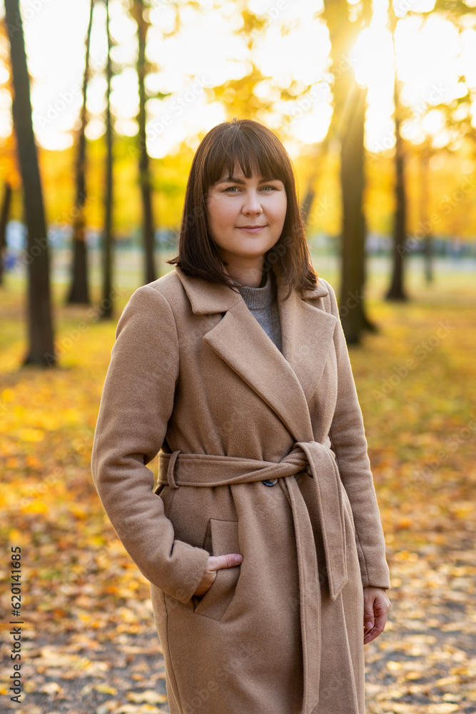 portrait of happy beautiful woman posing in autumn park portrait of happy beautiful woman posing in autumn park