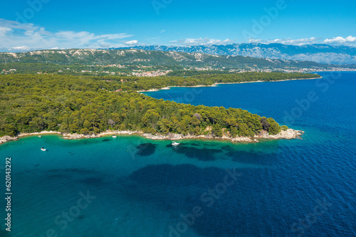 Aerial view of the rocky and forested coast of Rab Island, the Adriatic Sea in Croatia