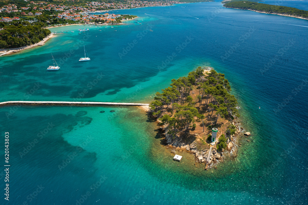 Aerial view of the rocky and forested coast of Rab Island, the Adriatic Sea in Croatia
