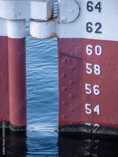 Картината върху платно Draft marks on a ship with red and white paint.