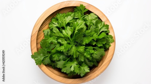 a wooden bowl filled with green leafy parsley