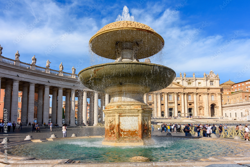 Fountain on St. Peter's square and St. Peter's basilica in Vatican