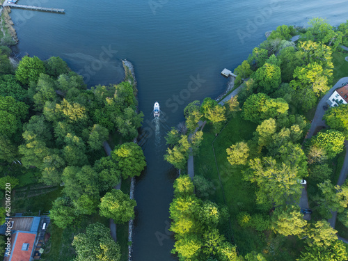 Aerial view of a boat leaving a canal in Stockholm county, Sweden.