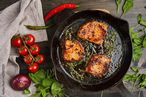 Tableau sur toile Pork tenderloin steak in cast iron skillet