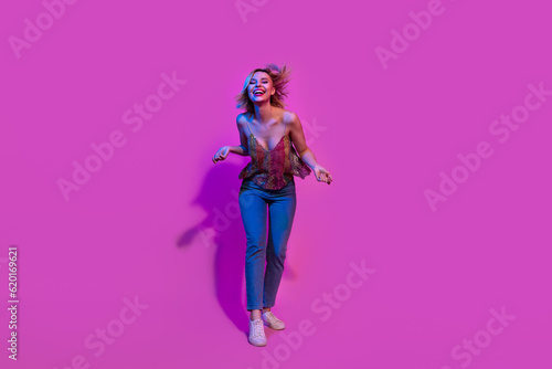 Full body photo of millennial lady dancing hip hop on night club isolated bright neon colorful background