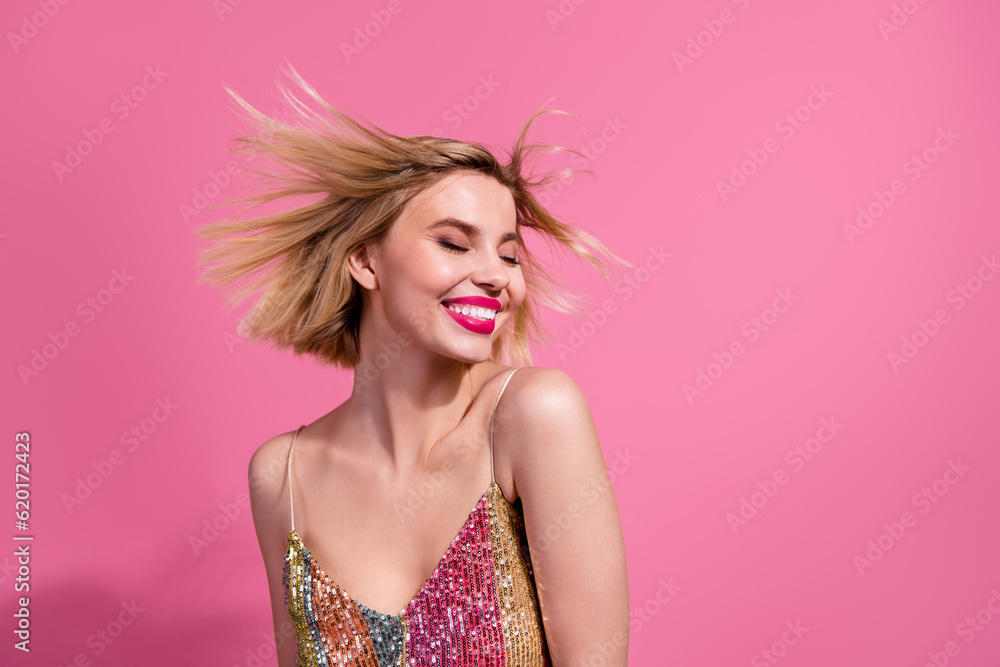 Photo of nice careless young blonde shiny lady wear sequins singlet dress festive windy motion hairstyle isolated on pink color background Photo of nice careless young blonde shiny lady wear sequins singlet dress festive windy motion hairstyle isolated on pink color background