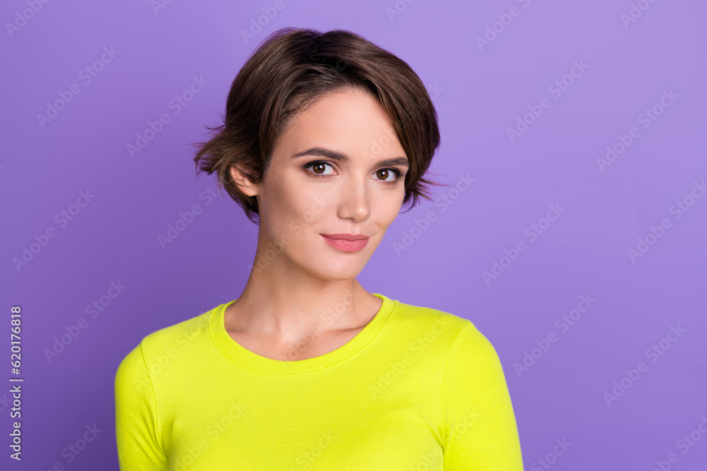 Fototapeta premium Portrait photo of young nice charming lady posing model wear yellow shirt satisfied vogue magazine isolated on violet color background