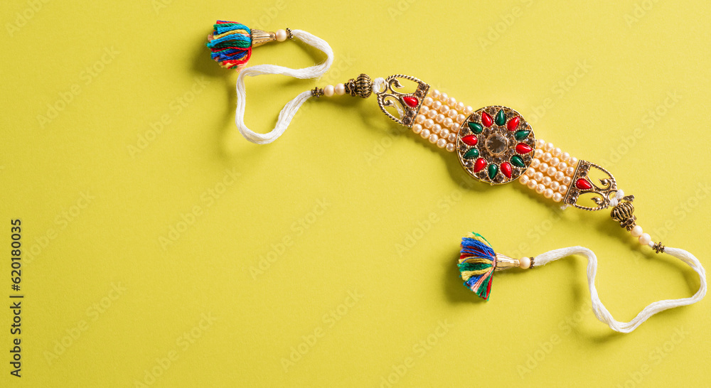 Raksha Bandhan, Indian festival with beautiful Rakhi and Rice Grains on ...