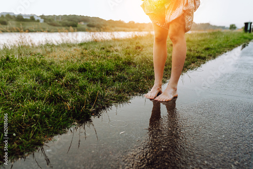 Slika na platnu Portrait happy teenage girl dancing barefoot after rain