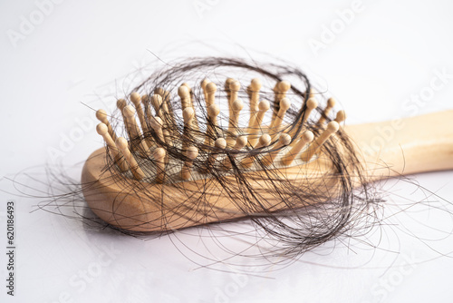 Hair loss fall with comb bush serious problem health, beauty and cosmetic concept.