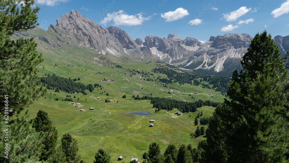 Green hilly meadows in the Geislerspitzen mountains (Gruppo delle Odle) in the Dolomites (Italian Alps) near Seceda mountain peak Green hilly meadows in the Geislerspitzen mountains (Gruppo delle Odle) in the Dolomites (Italian Alps) near Seceda mountain peak