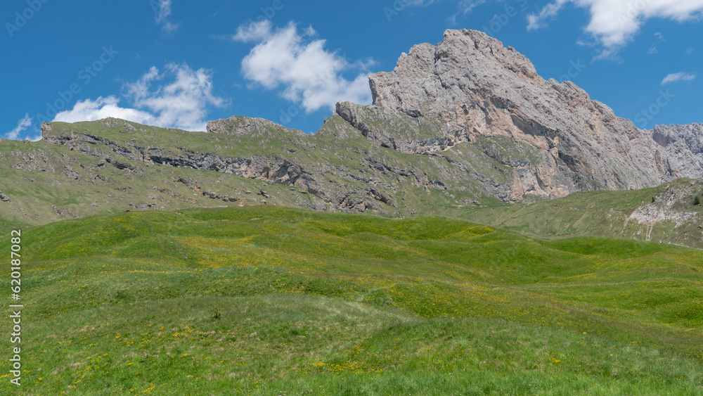 Green hilly meadows in the Geislerspitzen mountains (Gruppo delle Odle) in the Dolomites (Italian Alps) near Seceda mountain peak