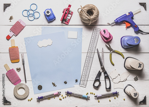 tools for scrapbooking on wooden boards and copy space