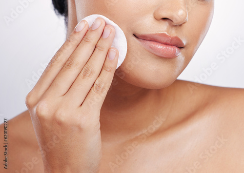 Beauty, skincare and cotton with face of woman for facial, makeup remover and cosmetics. Wellness, glow and self care with closeup of female model on white background for product, dermatology and spa