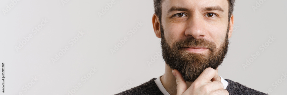 Fototapeta premium White mid man with beard posing and looking at camera