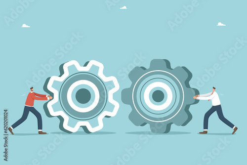 Teamwork to achieve the best result, creativity and intelligence to solve business problems, thinking in right direction, support and mutual assistance for business success, two men roll gears towards