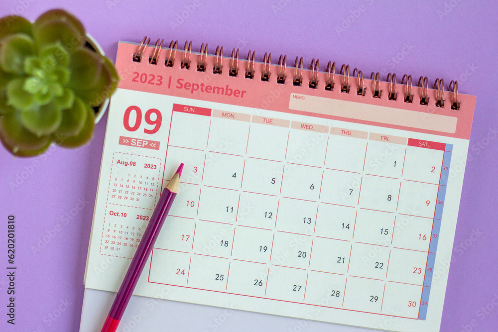 Desktop calendar for September 2023 on a lilac background. - obrazy, fototapety, plakaty 