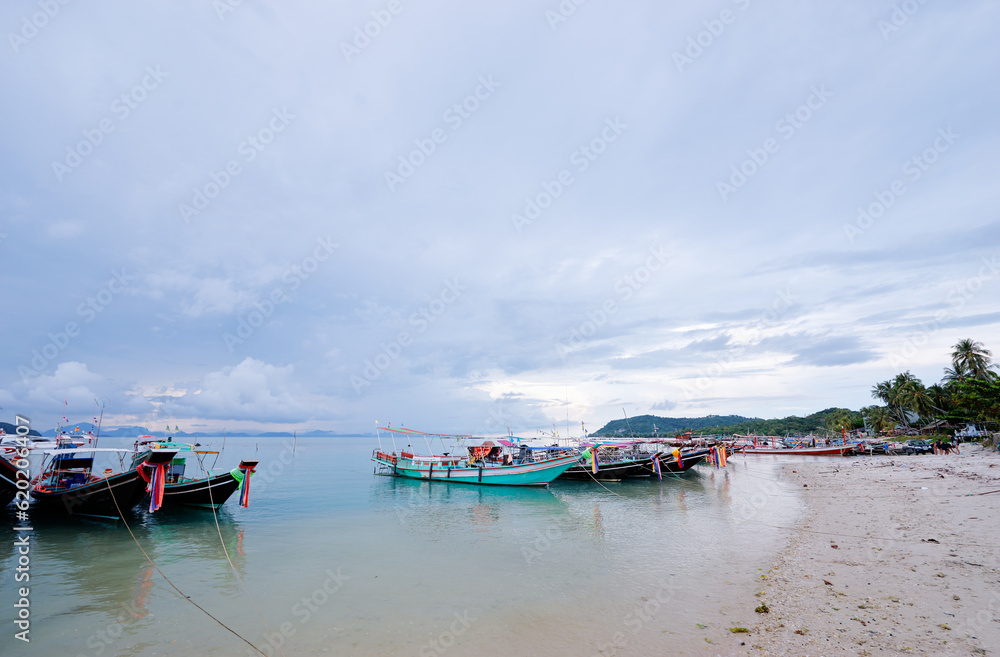 Beautiful landscape with traditional longtail boat on the beach. Samui, Thailand.
