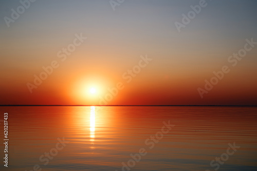 Beautuful sunset on the sea with sun reflecting in water