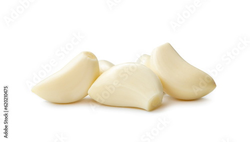 Peeled garlic cloves in stack isolated on white background with clipping path and shadow in png file format