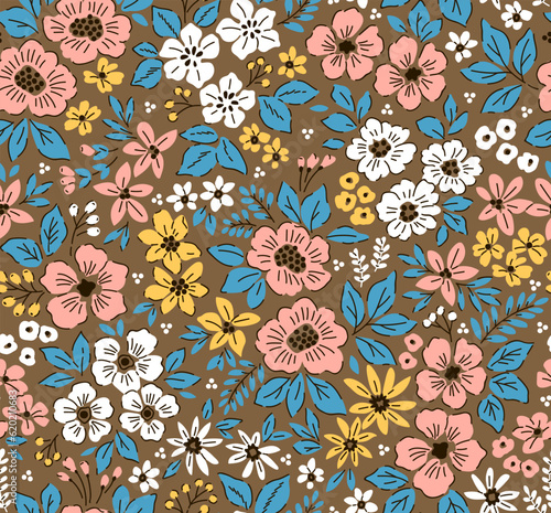 Vector seamless pattern. Vintage pattern in small flowers. Small colorful flowers. Light brown background. Ditsy floral background. Hand drawn flowers. Abstract contemporary modern trendy pattern. 