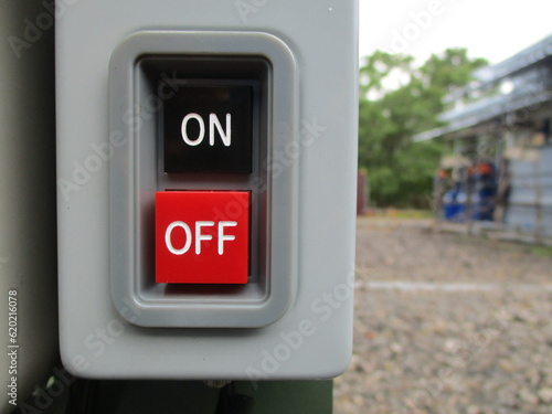 On Off switch on a machine. Close up of Push button. Copy space concept 