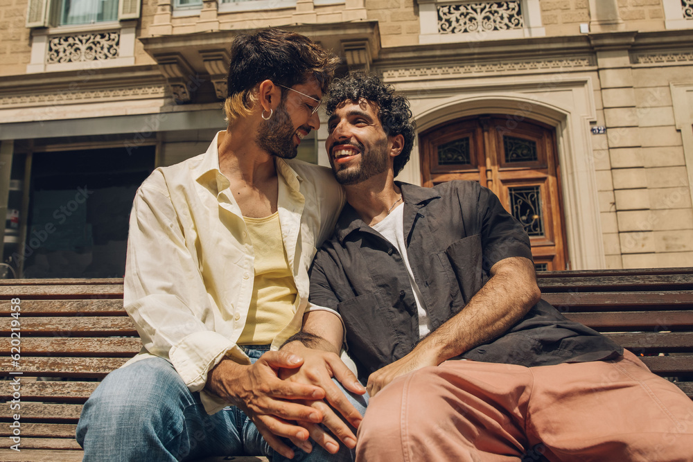 Fototapeta premium Happy gay couple kissing in the park. LGBT gay couple concept.
