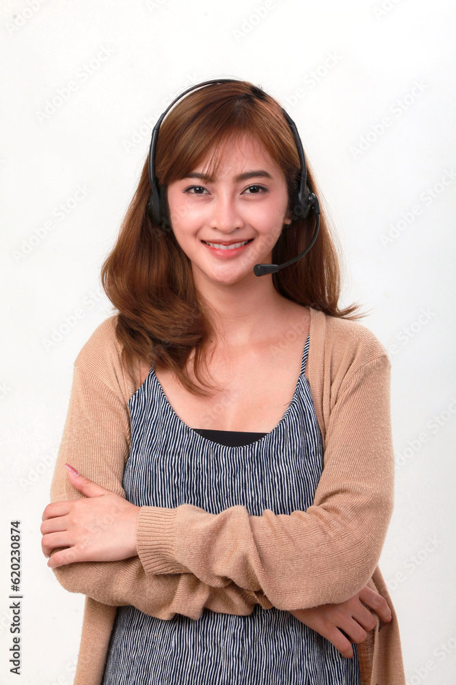 Young female receptionist wearing headset, isolated on white