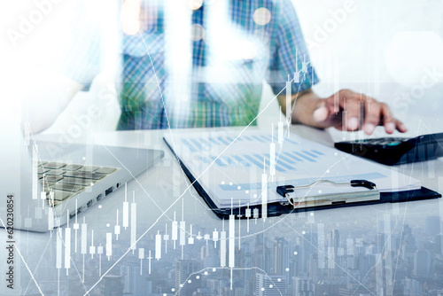 Double exposure of success businessman using digital financial graph or stock market