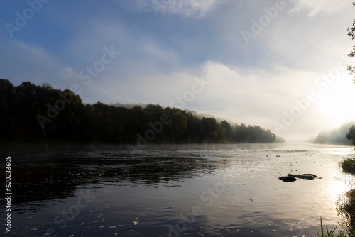 Small fog on the river in autumn